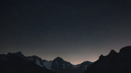 Naklejka premium A dark silhouette of a mountain range against a star-studded sky.
