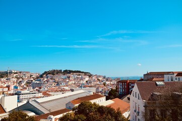 Fototapeta premium Aerial view of the city of Lisbon, Portugal under a blue sky