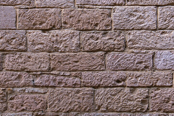 old stone wall of ancient building