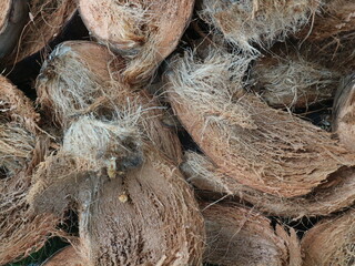 Piled dried coconut husks, natural abstract background