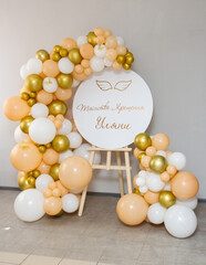 easel with a golden garland of balloons, inscription: 