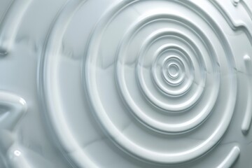 Obraz premium Abstract close-up image of a white circular pattern with concentric rings, creating a modern and minimalistic design.