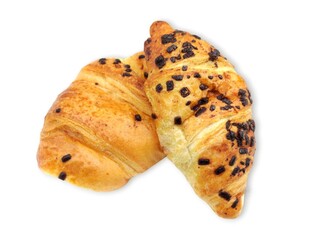 Closeup view of two delicious chocolate croissants garnished with chocolate piecies, isolated on white background.