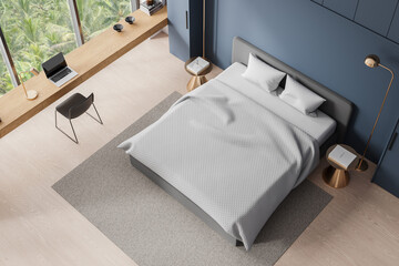 Top view of hotel bedroom interior with bed and work corner, panoramic window