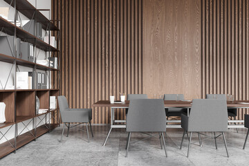 Stylish wooden meeting room interior with table and armchairs, shelf