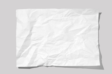 Crumpled piece of white parchment or baking paper on grey background. Top view. Copy space for text and design element.