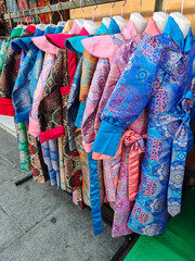 Naklejka premium Traditional Tibetan clothes are sold at a street store. Tibet