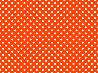 texturised white color polka dots over orange red background