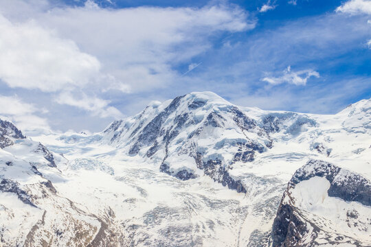 Magnificent panorama of the Pennine Alps with famous Gorner Glacier and impressive snow capped mountains Monte Rosa Massif close to Zermatt, Switzerland