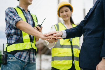 Asian Engineer and contractor join hands after signing contract,They are having a modern building project together.