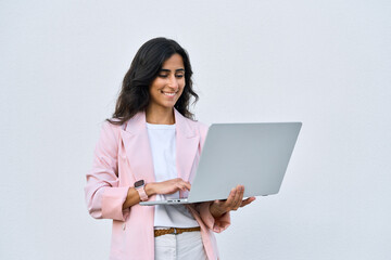 Focused young middle eastern Israel businesswoman using laptop pc online application for work...