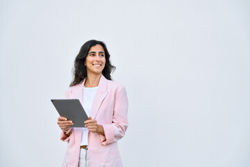 Young businesswoman arabic or indian ethnicity holding digital tablet, looking aside for promo...