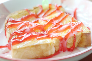 Toast with strawberry sauce on a plate