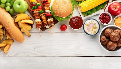 summer bbq food corner border hamburgers meat skewers potatoes fruit and snacks top down view on a...