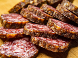 Gourmet Salami Display. Artfully arranged salami slices, suitable for deli promotions.