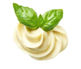 Creamy white swirled mayonnaise with green basil leaves, cut out