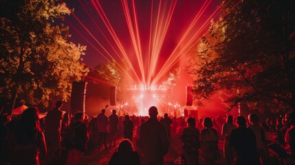 Outdoor night music party with laser lights and fire summer