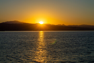 Obraz premium Sunrise over the beach and city in Malaga, Spain