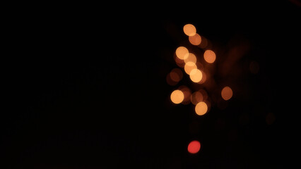 Blurred background of fireworks over night city stop motion aesthetic