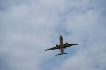 Airplane taking off in a cloudy sky