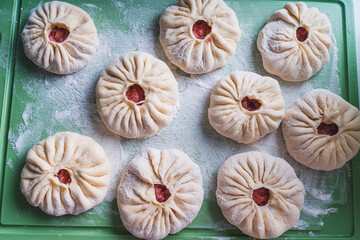 Glued belyashi, a traditional Tatar dish before being sent to skovorda.