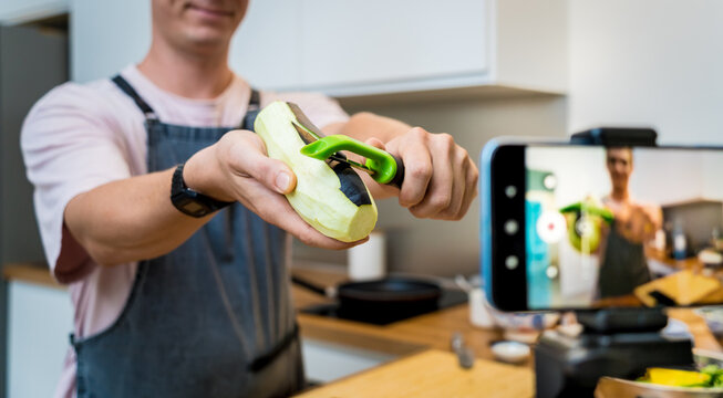 The chef is broadcasting live from workshop how to prepare a grilled eggplants with garlic