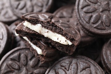 Tasty sandwich cookies as background, closeup view
