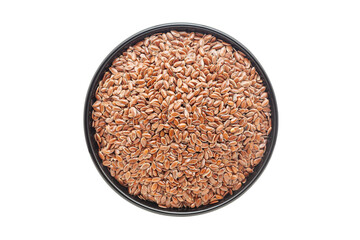 Organic Flaxseeds (Linum usitatissimum), in a black ceramic bowl. Isolated on a white background. Top View