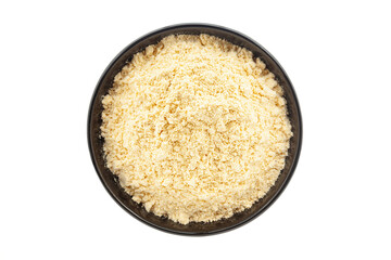 Organic Corn Flour (Zea mays) or Makka Flour, in a black ceramic bowl. Isolated on a white background. Top View