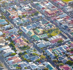Fototapeta premium Aerial view, city and residential suburb, location and destination for vacation, explore and travel. Tourism, drone and adventure in Sydney, Australia and street in hill, buildings and holiday