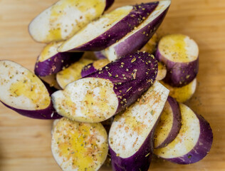 Delicious raw eggplants with garlic in the glass bowl