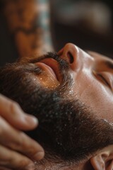Naklejka premium Close-Up of Hands Massaging Beard Oil into Thick Beard for Grooming and Shine Enhancement