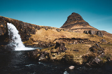 The famous mountain with a waterfall from the lord of the rings. untouched nature of Iceland