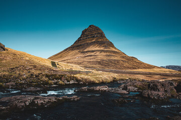 The famous mountain with a waterfall from the lord of the rings. untouched nature of Iceland