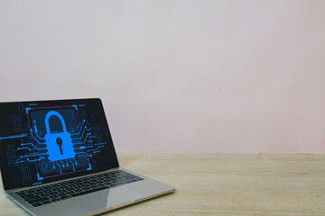 Data Privacy,Cybersecurity,Information security,Secure networks,Digital information concept.,Laptop on a table with a blank screen featuring a digital padlock and cyber security network icon.