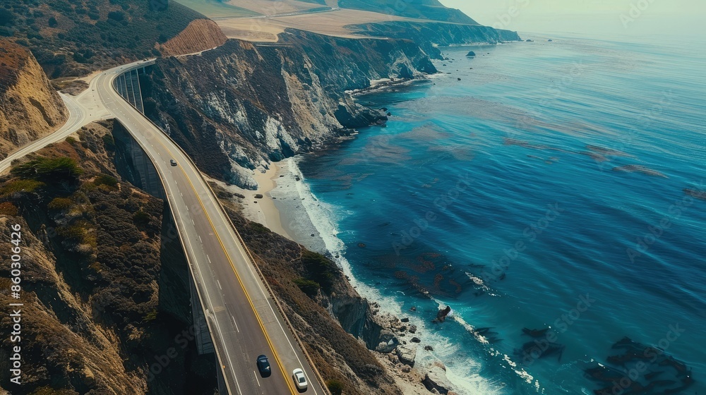 Poster highway overpass seen from the air with dramatic cliffs and ocean in the background