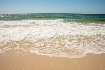 The Gulf of Mexico rinses the sand between waves in mid-April within Gulf State Park, Gulf Shores, Alabama