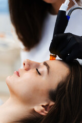 Hydrafacial facial cleansing skincare procedure to moisturizing facial skin. Cleansing skin with...