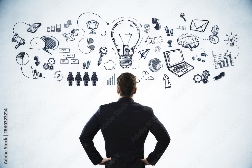 Poster a man in a suit looking at a wall with various business and creative concept doodles on a light back
