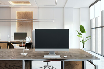 Modern office setup with a desktop computer on a wooden table, large windows, and a plant, on a light background, concept of workplace. 3D Rendering