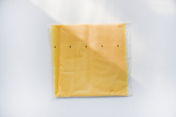 Melted cheese in flat slices. Processed cream cheese for sandwiches.