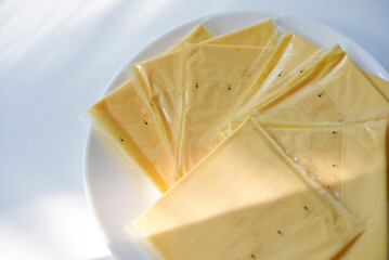 Melted cheese in flat slices. Processed cream cheese for sandwiches.