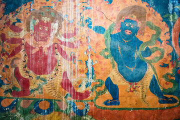 A detailed view of a vibrant tibetan deity painting displayed on a wall, Lingshet Monastery in Zanskar