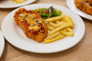 fried chicken chop with french fries with cheese