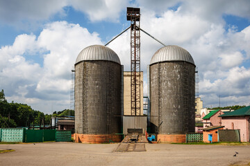 silos on agro-industrial complex with seed cleaning and drying line for grain storage. Granary elevator