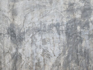 Cement walls or plaster walls are in old condition. Cracks and stains occur. Walls outside buildings exposed to sunlight, rain, and dust often become dirty and corrode. unevenly colored walls
