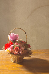 rose plastic in basket still life valentine