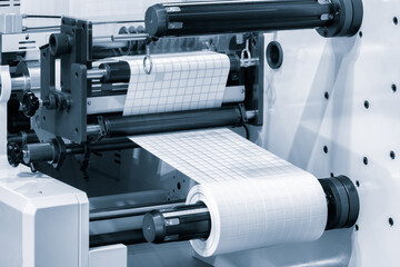 A roll of white paper is passed through the machine. printer and sticker machine, which is used for...