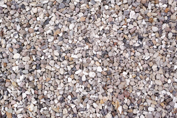 Gray, texture art and background with pebbles for wallpaper, interior design and low tide on beach. Calm, nature and lakeside from above for decor with rocks, round stones and outdoor in summer