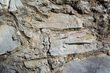 Mountain, rock and surface of stone wall outdoor in nature for abseiling, hiking or recreation. Background, texture and wallpaper with rugged exterior in natural environment for adventure or escape